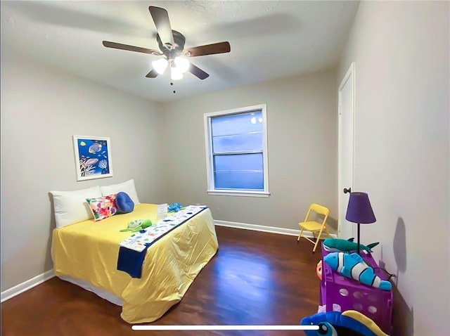 717 Grantham Rd, Baytown, TX 77521 - bedroom with baseboards, wood finished floors, and ceiling fan