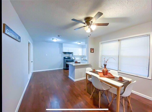 717 Grantham Rd, Baytown, TX 77521 - dining space with ceiling fan, dark wood-style flooring, baseboards, and a textured ceiling