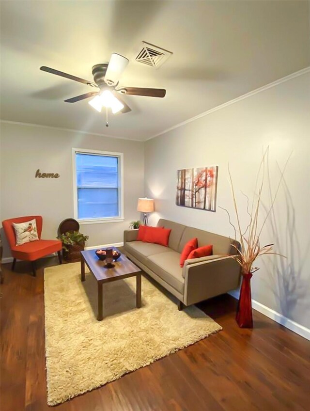 717 Grantham Rd, Baytown, TX 77521 - living room featuring wood finished floors, crown molding, ceiling fan, and baseboards