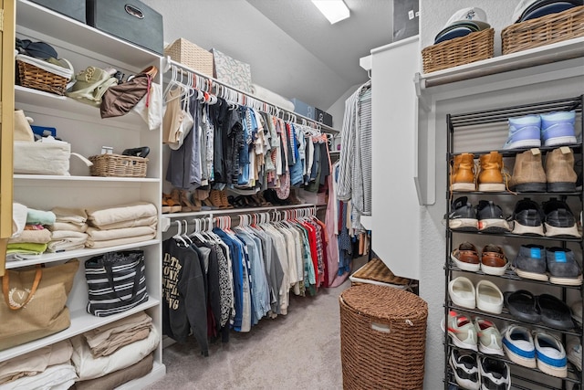 2221 Hay Field Ct, Conroe, TX 77384 - spacious closet featuring carpet flooring and lofted ceiling