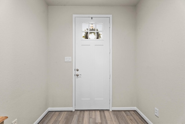 2221 Hay Field Ct, Conroe, TX 77384 - foyer entrance featuring wood finished floors and baseboards