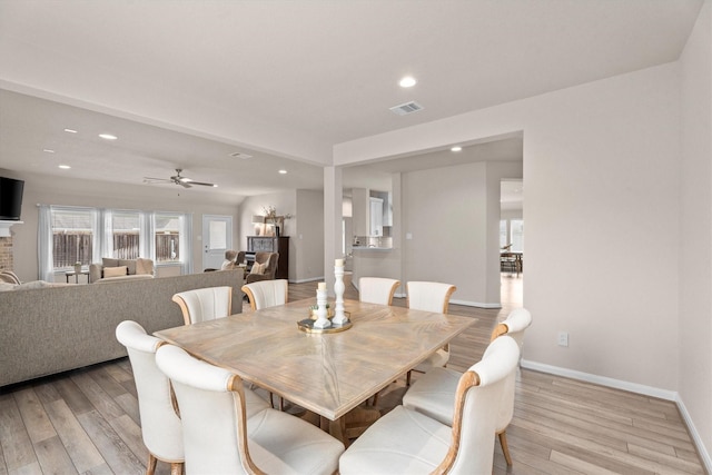 2221 Hay Field Ct, Conroe, TX 77384 - dining space with recessed lighting, light wood-style flooring, baseboards, ceiling fan, and a fireplace