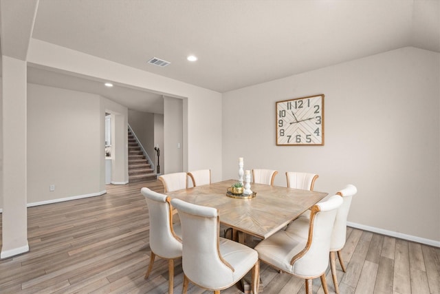 2221 Hay Field Ct, Conroe, TX 77384 - dining room featuring light wood-type flooring, stairs, recessed lighting, and baseboards