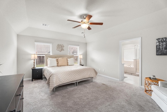 2221 Hay Field Ct, Conroe, TX 77384 - bedroom featuring light colored carpet, ensuite bath, baseboards, and a ceiling fan