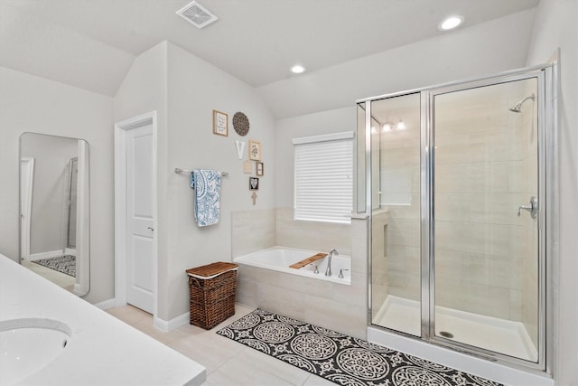 2221 Hay Field Ct, Conroe, TX 77384 - full bathroom with a shower stall, lofted ceiling, a garden tub, tile patterned flooring, and baseboards