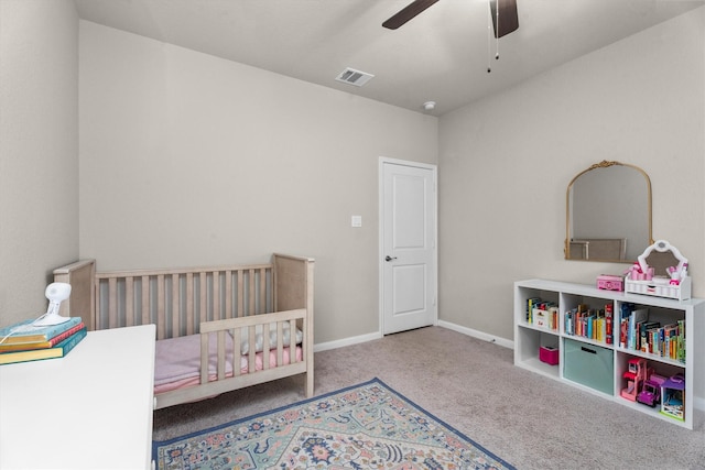 2221 Hay Field Ct, Conroe, TX 77384 - bedroom featuring carpet, baseboards, a ceiling fan, and a nursery area
