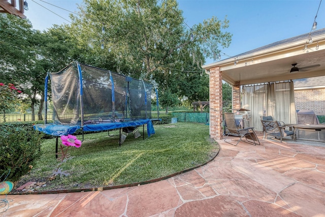 8807 Stones Throw Ln, Missouri City, TX 77459 - view of yard with a trampoline, a patio area, and ceiling fan
