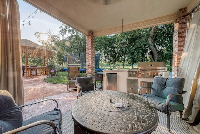 8807 Stones Throw Ln, Missouri City, TX 77459 - view of patio featuring a trampoline and outdoor dining area
