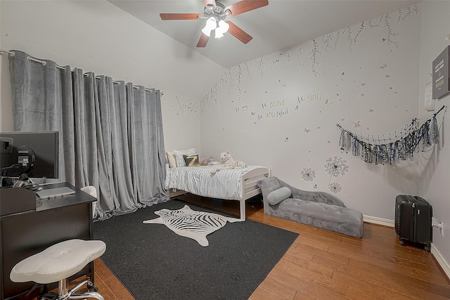 8807 Stones Throw Ln, Missouri City, TX 77459 - bedroom featuring wood finished floors, a desk, lofted ceiling, ceiling fan, and baseboards