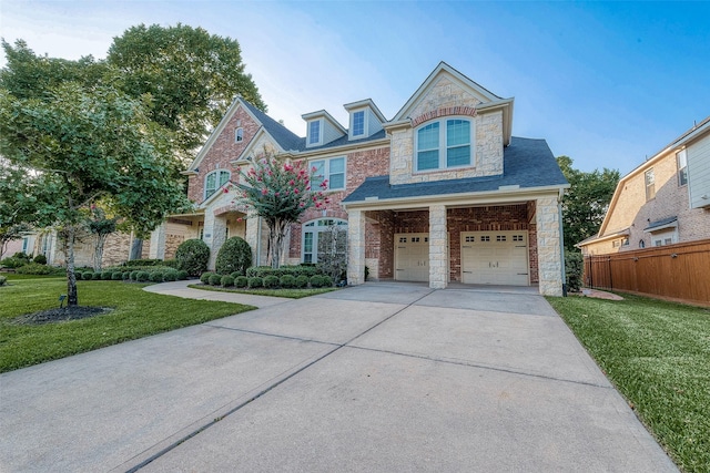 8807 Stones Throw Ln, Missouri City, TX 77459 - view of front of property with stone siding, driveway, and an attached garage