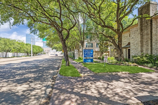 5135 Edloe St, Houston, TX 77005 - view of asphalt street featuring sidewalks and curbs
