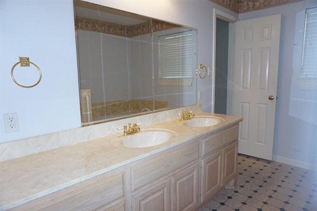 19710 Lowe St, Porter, TX 77365 - bathroom with double vanity, a shower with door, and baseboards