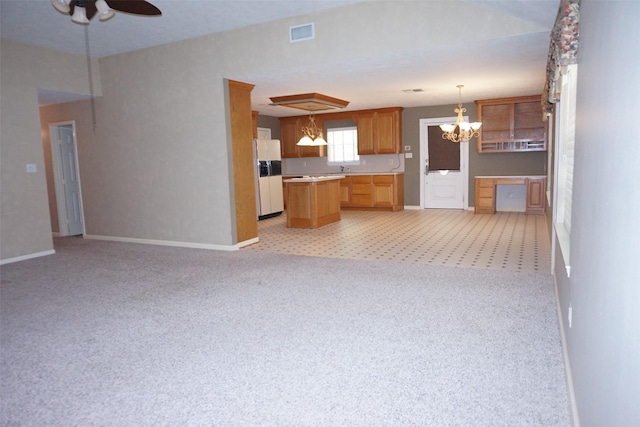 19710 Lowe St, Porter, TX 77365 - kitchen with open floor plan, white refrigerator with ice dispenser, light countertops, and a center island