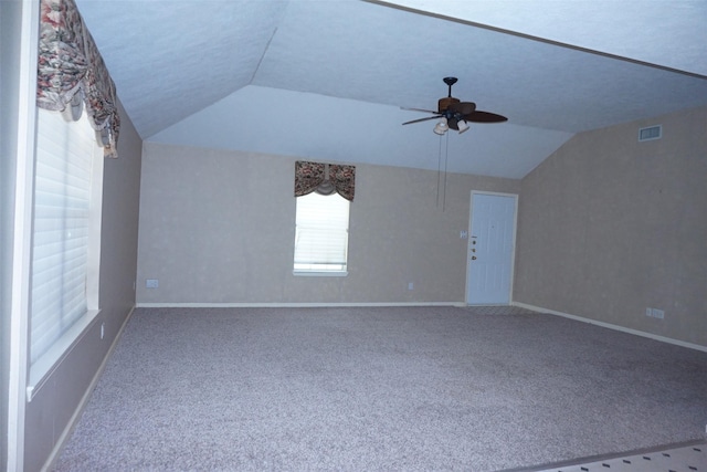 19710 Lowe St, Porter, TX 77365 - carpeted empty room with lofted ceiling, a ceiling fan, and baseboards