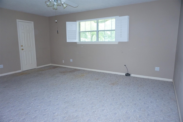 19710 Lowe St, Porter, TX 77365 - spare room featuring carpet floors, baseboards, and a ceiling fan