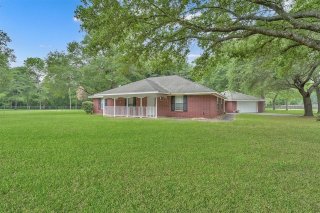 19710 Lowe St, Porter, TX 77365 - single story home featuring a porch, brick siding, and a garage