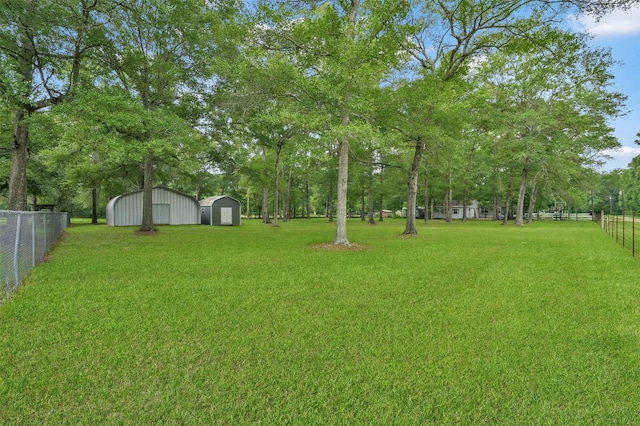 19710 Lowe St, Porter, TX 77365 - view of yard featuring a garage