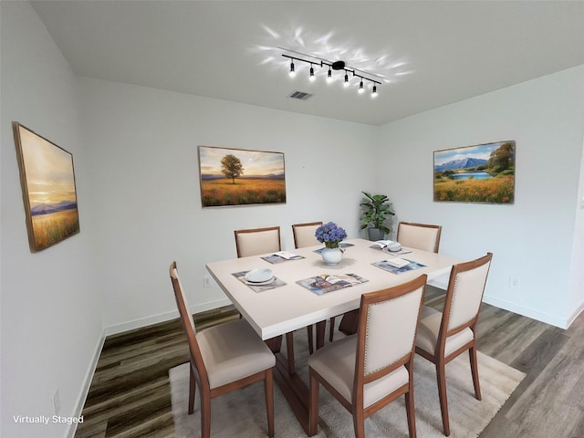 3231 Langley Bend Ln, Fulshear, TX 77441 - dining area featuring wood finished floors, baseboards, and rail lighting