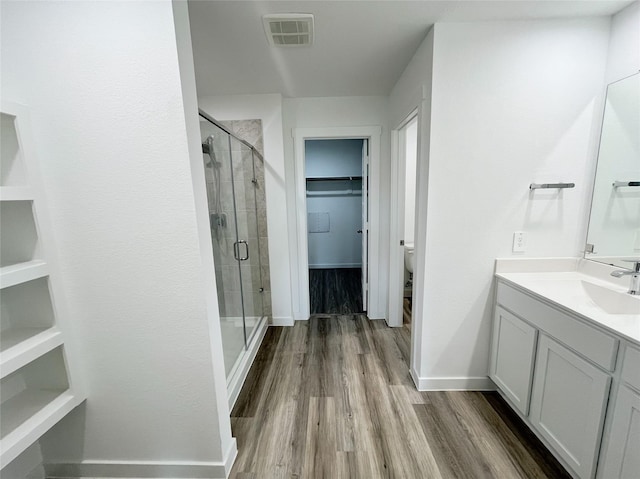 3231 Langley Bend Ln, Fulshear, TX 77441 - bathroom with a shower stall, baseboards, vanity, wood finished floors, and toilet