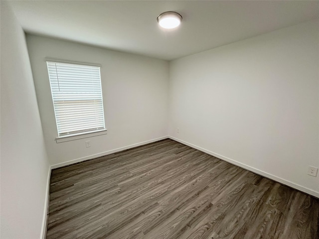 3231 Langley Bend Ln, Fulshear, TX 77441 - empty room featuring dark wood-type flooring and baseboards