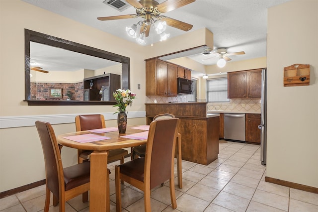 1109 Alan St, Deer Park, TX 77536 - dining room featuring a ceiling fan, light tile patterned floors, and baseboards