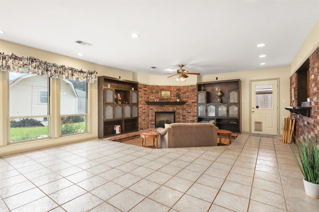 1109 Alan St, Deer Park, TX 77536 - tiled living area with a fireplace, a ceiling fan, and recessed lighting