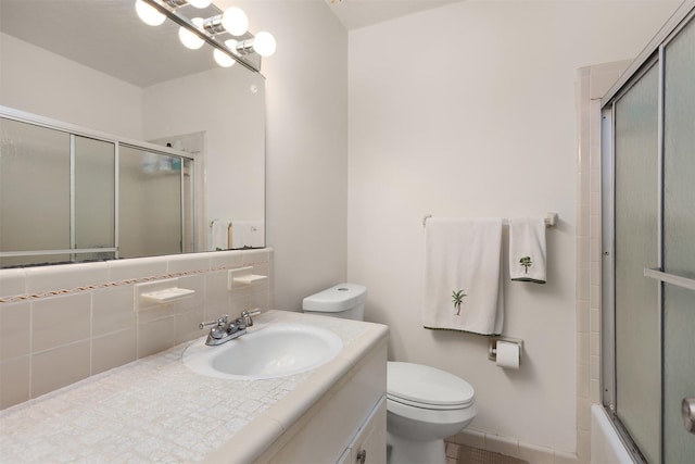 1109 Alan St, Deer Park, TX 77536 - bathroom featuring toilet, vanity, decorative backsplash, and enclosed tub / shower combo