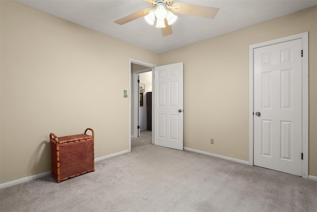 1109 Alan St, Deer Park, TX 77536 - unfurnished bedroom with light colored carpet, baseboards, and a ceiling fan