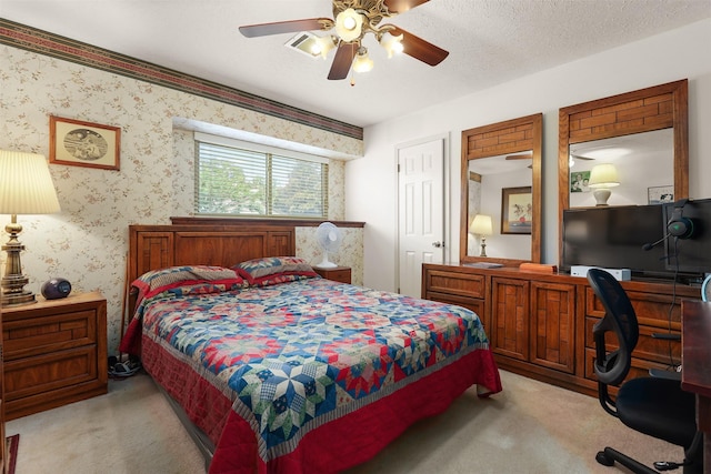 1109 Alan St, Deer Park, TX 77536 - bedroom with light carpet, a desk, and a ceiling fan