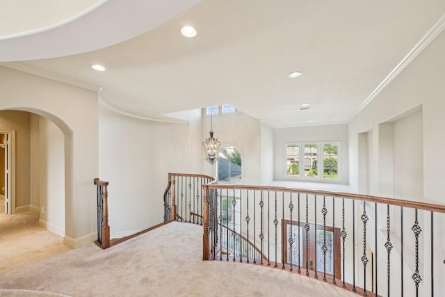 24807 Thorton Knolls Dr, Spring, TX 77389 - hallway featuring carpet flooring, ornamental molding, an upstairs landing, recessed lighting, and baseboards