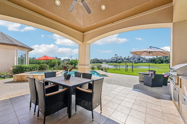 24807 Thorton Knolls Dr, Spring, TX 77389 - view of patio featuring a ceiling fan, outdoor dining area, a water view, and a residential view