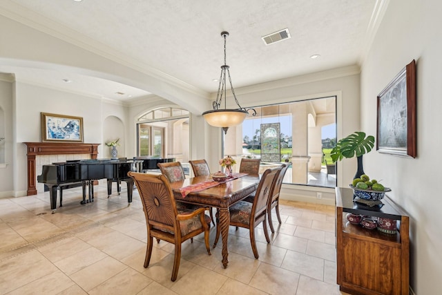 24807 Thorton Knolls Dr, Spring, TX 77389 - dining space featuring arched walkways, light tile patterned flooring, ornamental molding, and recessed lighting