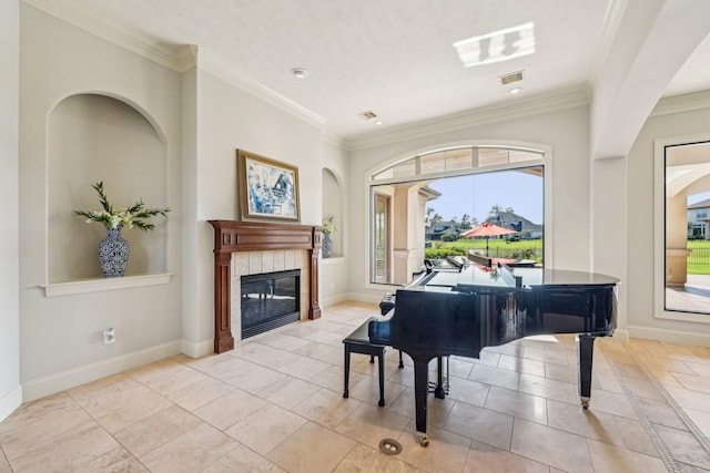 24807 Thorton Knolls Dr, Spring, TX 77389 - living area featuring a tile fireplace, light tile patterned floors, baseboards, ornamental molding, and arched walkways