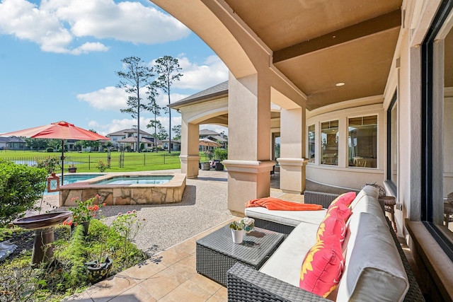 24807 Thorton Knolls Dr, Spring, TX 77389 - view of patio / terrace with an in-ground hot tub