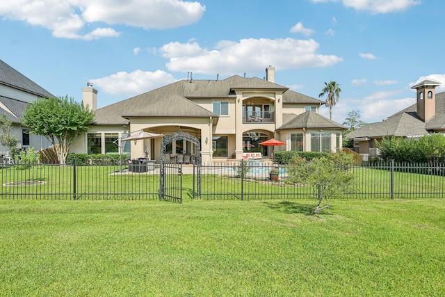 24807 Thorton Knolls Dr, Spring, TX 77389 - rear view of property with a balcony, a chimney, stucco siding, and a patio