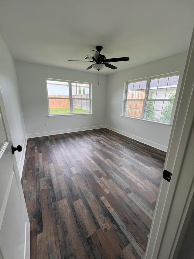 1618 Del Norte St, Houston, TX 77018 - spare room with dark wood finished floors, plenty of natural light, a ceiling fan, and baseboards