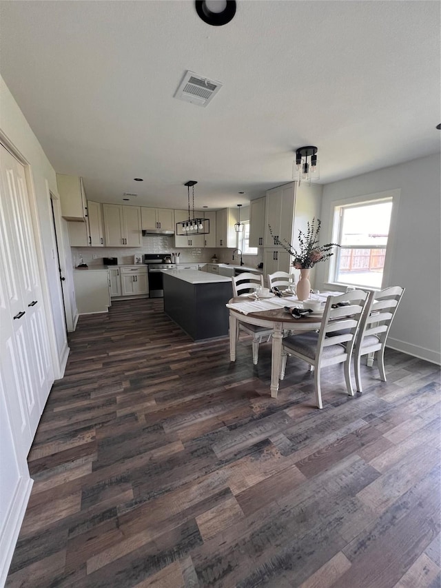 1618 Del Norte St, Houston, TX 77018 - dining space featuring dark wood finished floors and baseboards