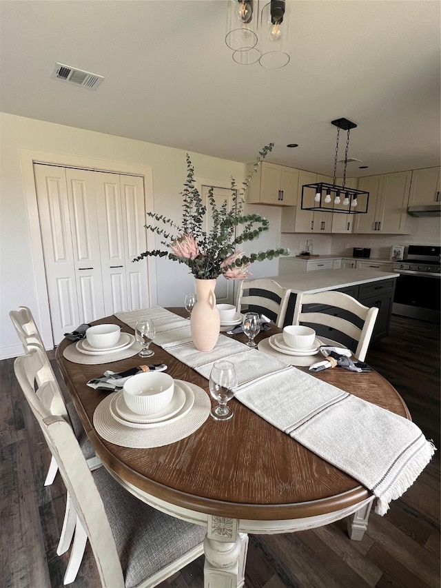 1618 Del Norte St, Houston, TX 77018 - dining area with dark wood-style flooring and a chandelier