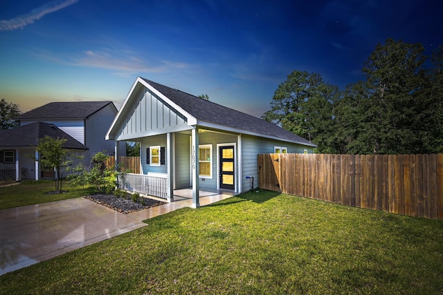 17070 Marie Village Dr, Conroe, TX 77306 - view of front of home featuring board and batten siding, a porch, and roof with shingles