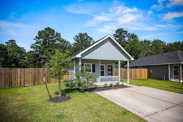 17070 Marie Village Dr, Conroe, TX 77306 - view of front of property featuring board and batten siding and a porch