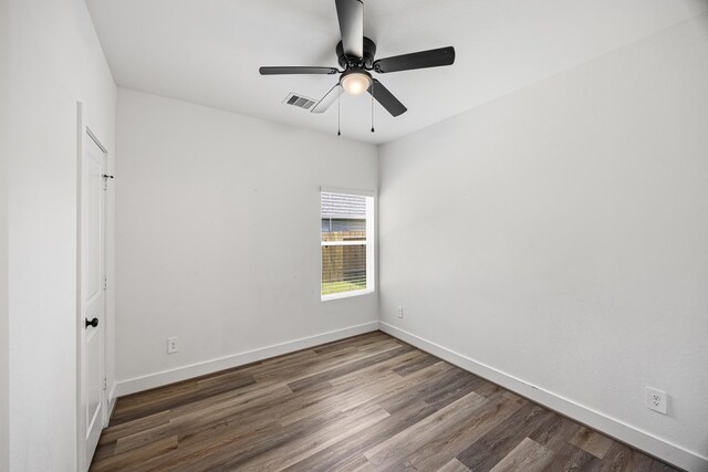 17070 Marie Village Dr, Conroe, TX 77306 - unfurnished room with wood finished floors, baseboards, and a ceiling fan