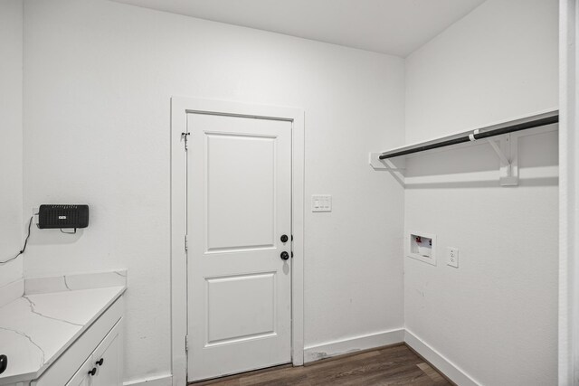 17070 Marie Village Dr, Conroe, TX 77306 - washroom with cabinet space, dark wood-style floors, hookup for a washing machine, and baseboards