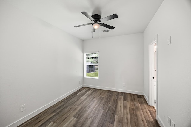 17070 Marie Village Dr, Conroe, TX 77306 - spare room featuring dark wood-type flooring, baseboards, and ceiling fan
