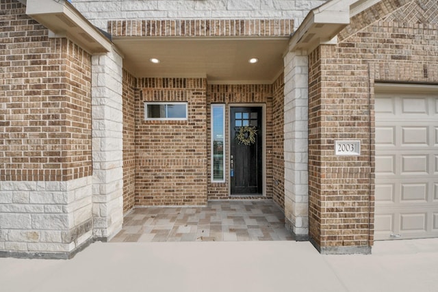 2003 Marthoman Dr, Missouri City, TX 77489 - view of exterior entry featuring brick siding and an attached garage
