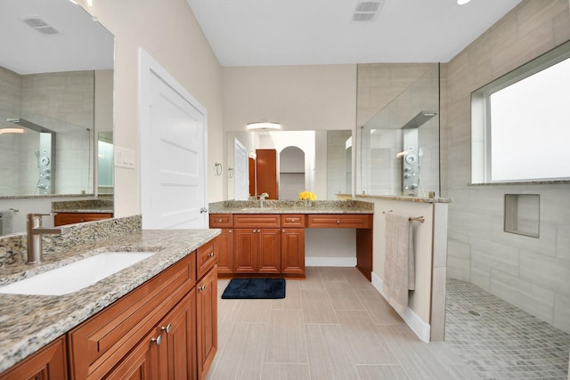 2003 Marthoman Dr, Missouri City, TX 77489 - bathroom with a walk in shower, two vanities, baseboards, and tile patterned floors