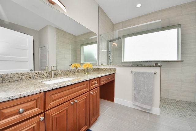 2003 Marthoman Dr, Missouri City, TX 77489 - bathroom with walk in shower, vanity, tile patterned flooring, and baseboards