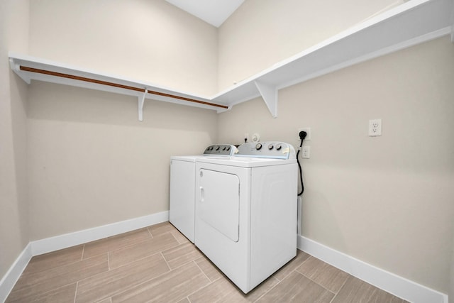 2003 Marthoman Dr, Missouri City, TX 77489 - washroom featuring washer and dryer, baseboards, and wood tiled floors