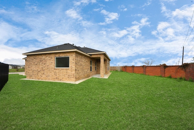 2003 Marthoman Dr, Missouri City, TX 77489 - rear view of property featuring brick siding, a patio, and a shingled roof