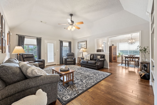 6509 Patricia St, Katy, TX 77493 - living area featuring lofted ceiling, plenty of natural light, a chandelier, hardwood / wood-style floors, and a textured ceiling