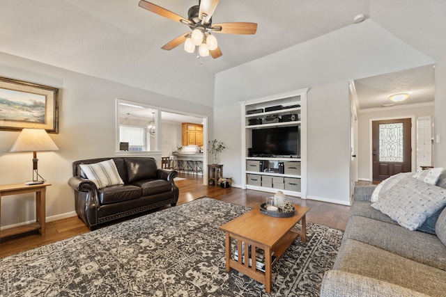 6509 Patricia St, Katy, TX 77493 - living area featuring wood finished floors, baseboards, a ceiling fan, and high vaulted ceiling